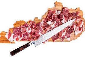 ham on cutting board with knife